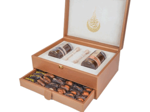 Luxury golden leather box containing (250g Sidr honey and 250g Samr honey) with a layer of dates and nuts